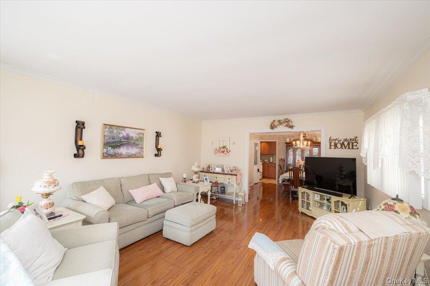 Welcome to 198-15 33rd Ave, a charming single-family home tucked - photo 4