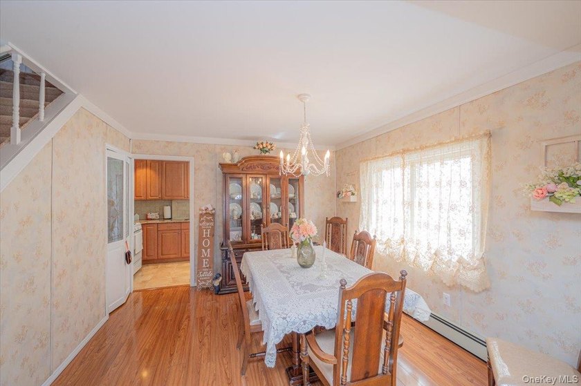 Welcome to 198-15 33rd Ave, a charming single-family home tucked - photo 7