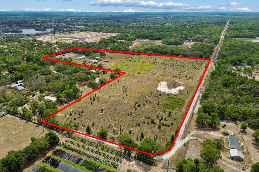 Discover a rare 27-acre opportunity in Hudson, FL, spanning two - photo 2