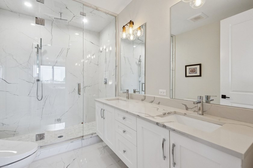 Sun-drenched penthouse offering 3 bedrooms, 2 baths, and an - photo 22