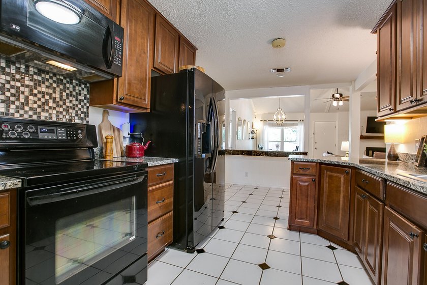 Welcome home to this beautifully updated 4-bedroom, 2-bathroom - photo 9