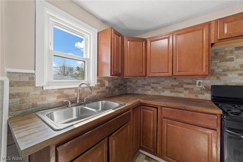 Welcome to 17904 Neff Rd in Euclid, a charming home located on a - photo 8