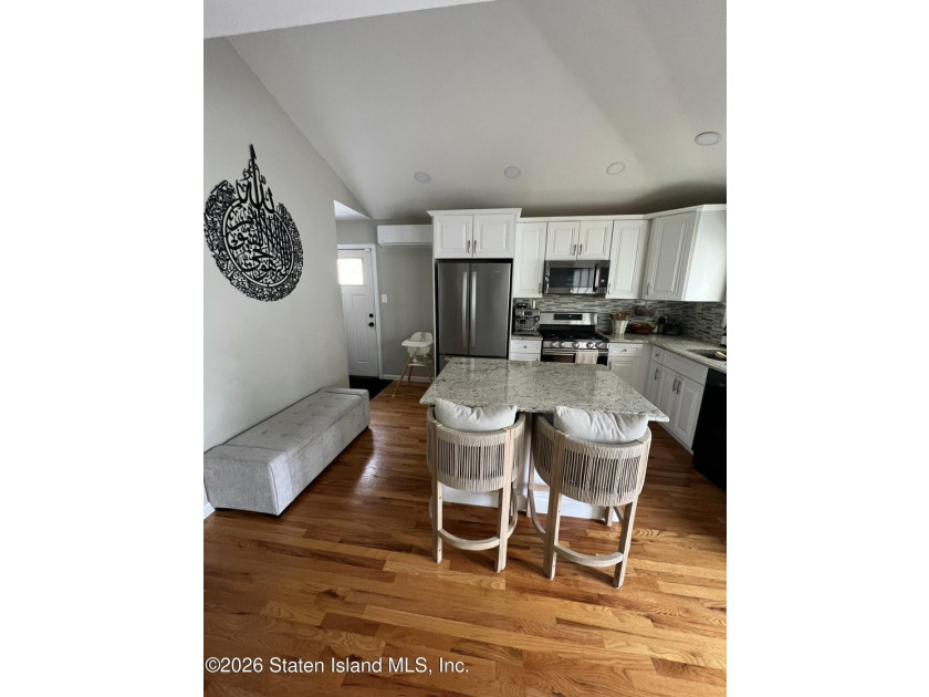 Welcome to this beautifully renovated 3-bedroom ranch that - photo 2