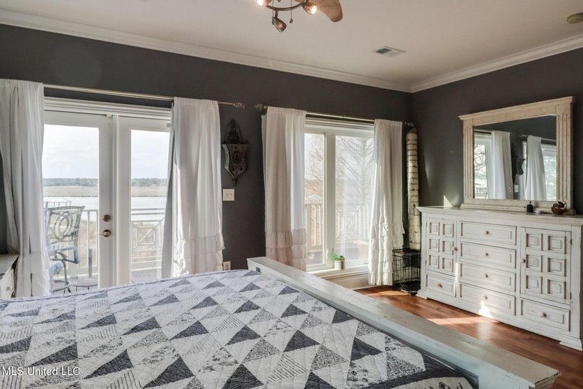 Introducing a rare riverfront retreat in the sought-after - photo 26