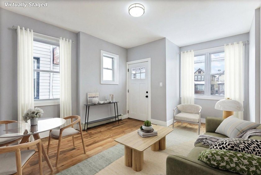 JUST LISTED MOVE-IN READY SUNNY SOUTH-FACING 2-FAMILY TOWNHOUSE - photo 2