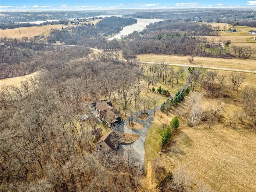 Welcome to this exceptional custom-built retreat set on over 4 - photo 3