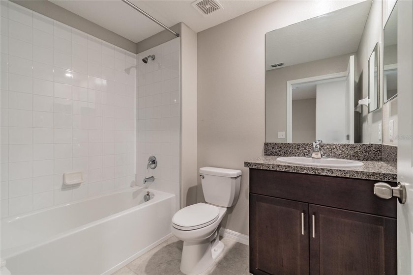 Welcome home to this beautifully maintained, barely lived-in - photo 8
