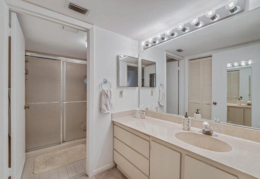 This turnkey 55+ community condo is move-in ready, featuring a - photo 13