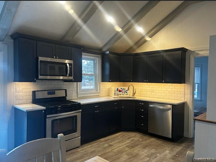 Tucked away on a private .72-acre flag lot, this cozy 2-bedroom - photo 4