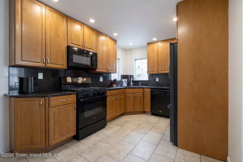 Charming and sun-filled, this 3-bedroom, 2-bath, 1,528 sq ft - photo 3