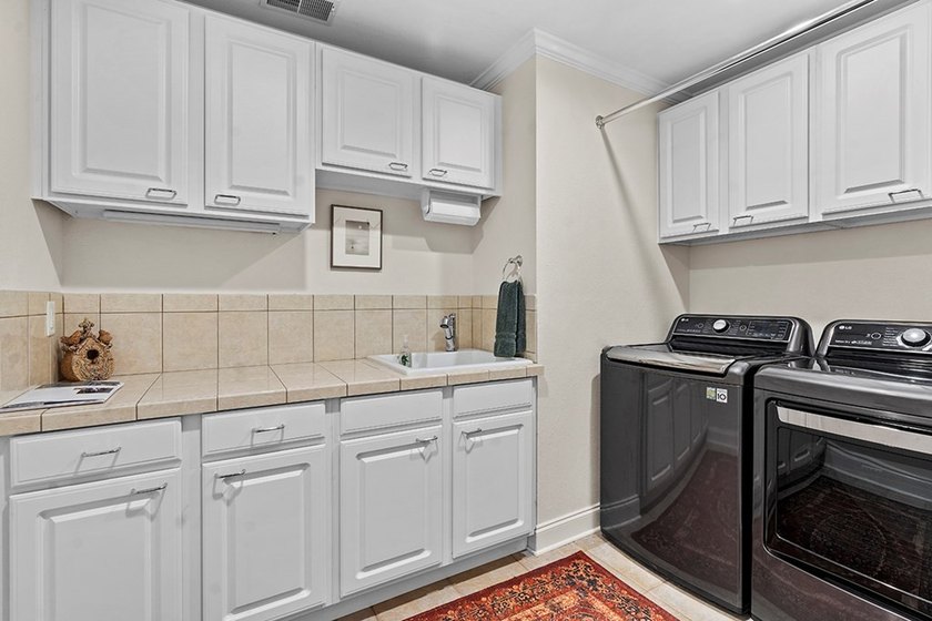 This exquisite Grand Harbor home makes a stunning first - photo 23