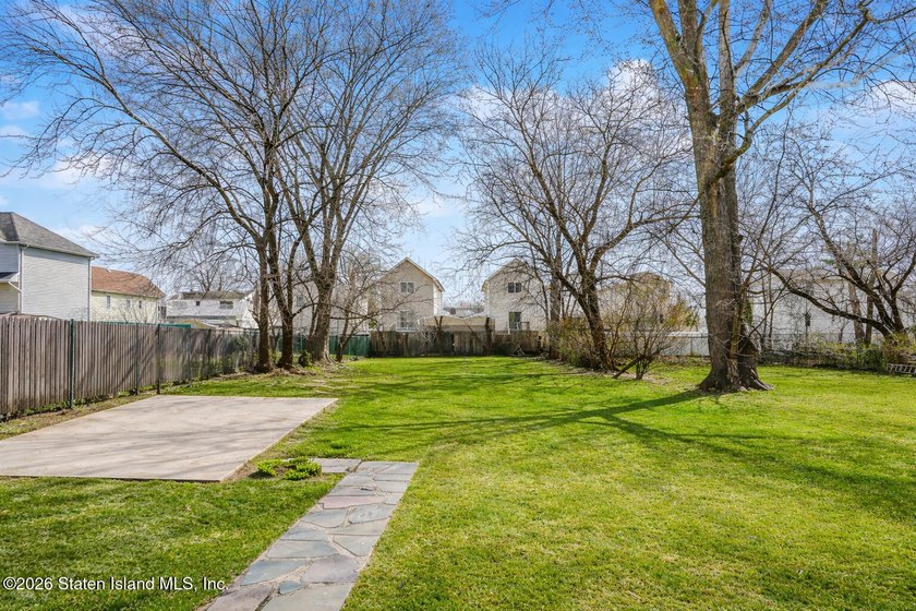 Welcome to 225 Van Name Avenue! This well-maintained 3-bedroom - photo 3