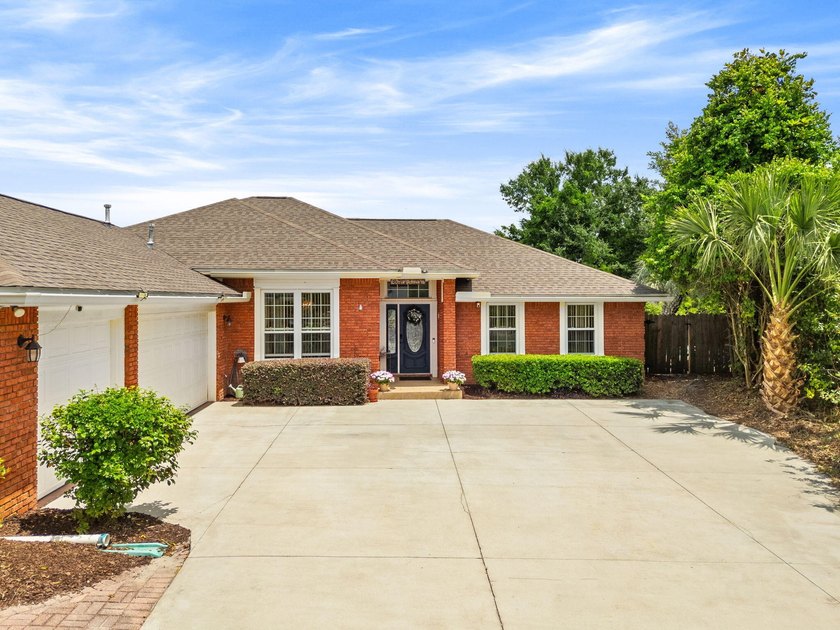 Welcome to this beautifully maintained all-brick home tucked - photo 3