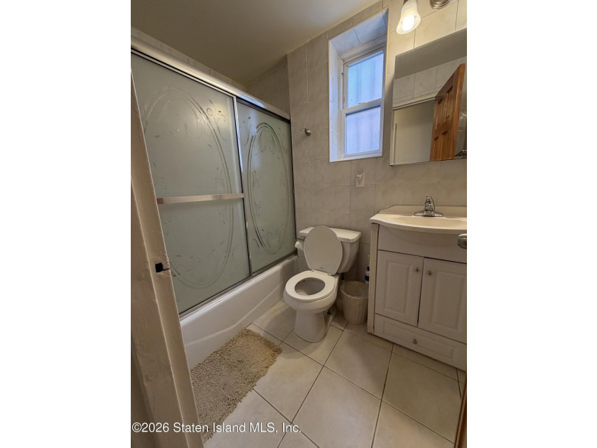 Welcome to 1066 East 100th Street, a well-maintained two-family - photo 4