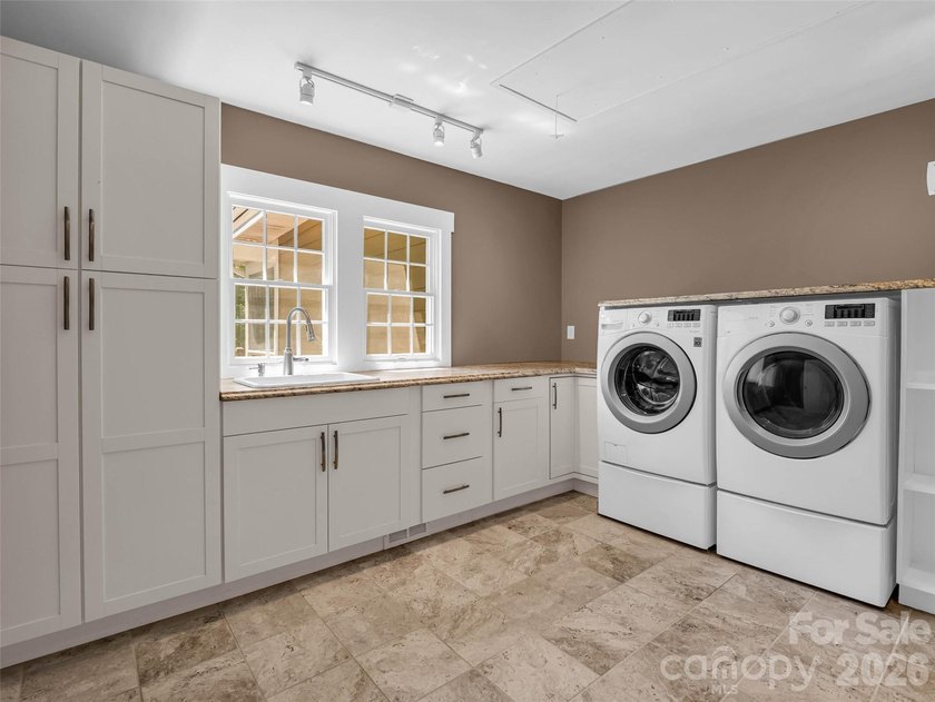 Discover unparalleled single-level living and privacy in the - photo 21