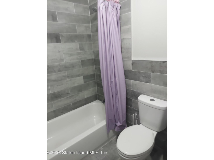2 FAMILY END UNIT HAS A 3 BEDROOM MAIN AND A BRAND NEW STUDIO - photo 4