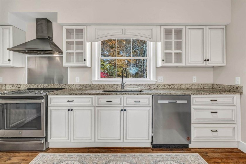 Set gracefully on 1.55 acres and positioned back from the road - photo 17