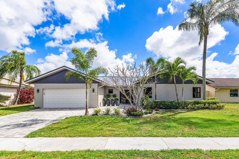 Stunning Modern Home with Heated Pool! Situated in desirable - photo 3