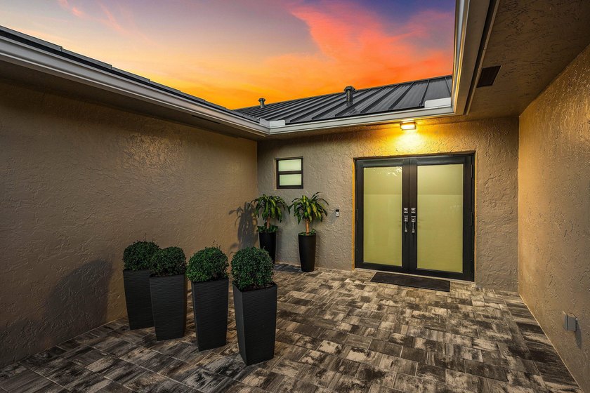Stunning Modern Home with Heated Pool! Situated in desirable - photo 4
