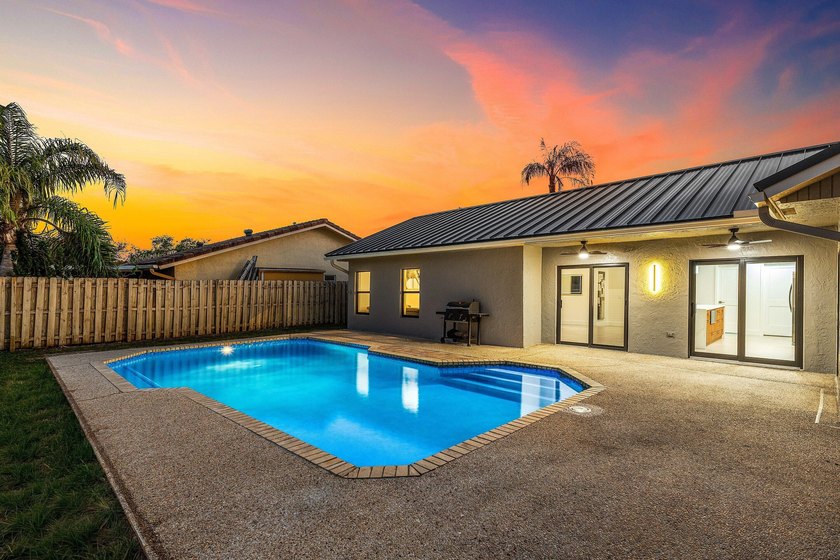 Stunning Modern Home with Heated Pool! Situated in desirable - photo 6