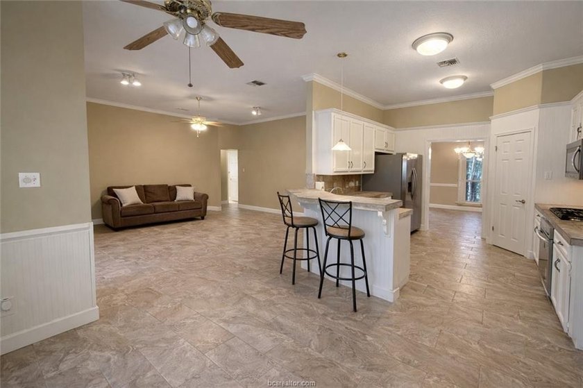 Situated on nearly three-quarters of an acre beneath mature - photo 8