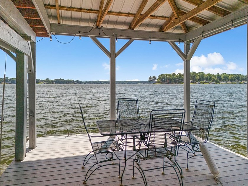This lakefront home offers breathtaking long-range views - photo 12