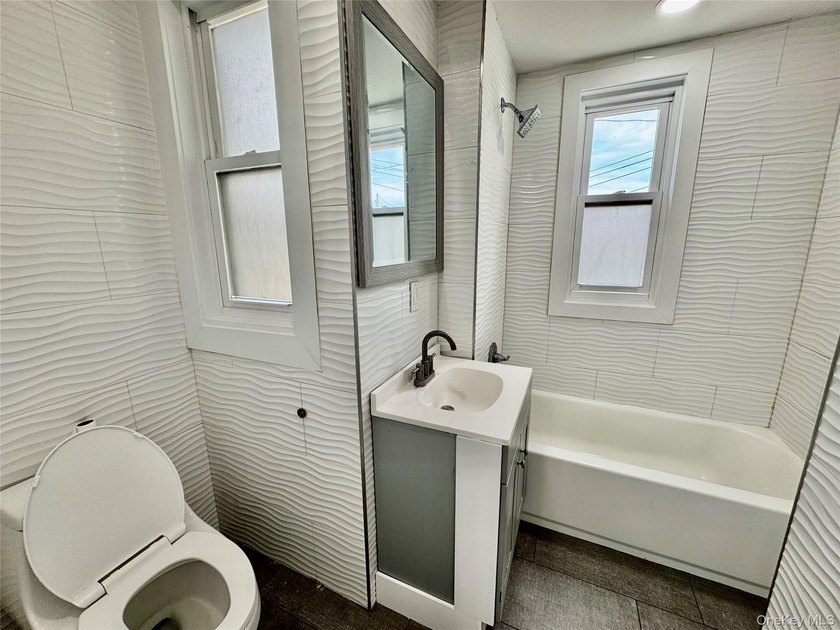 Welcome to this income-producing residential property in the - photo 16