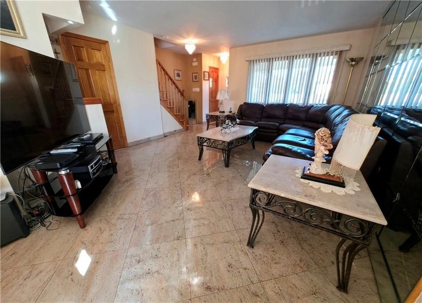 Move right into this beautifully renovated semi-attached - photo 3