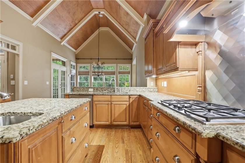 Nestled behind a sweeping lawn on a private, tree-lined lot - photo 15