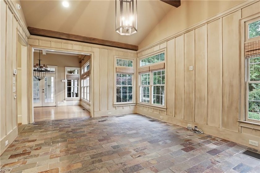 Nestled behind a sweeping lawn on a private, tree-lined lot - photo 21