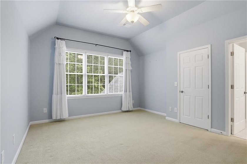 Nestled behind a sweeping lawn on a private, tree-lined lot - photo 29