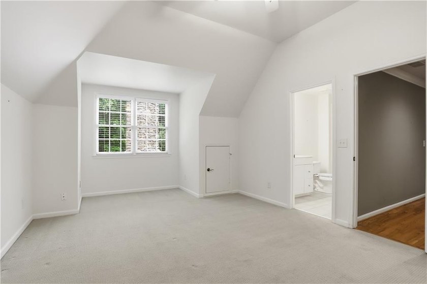 Nestled behind a sweeping lawn on a private, tree-lined lot - photo 31
