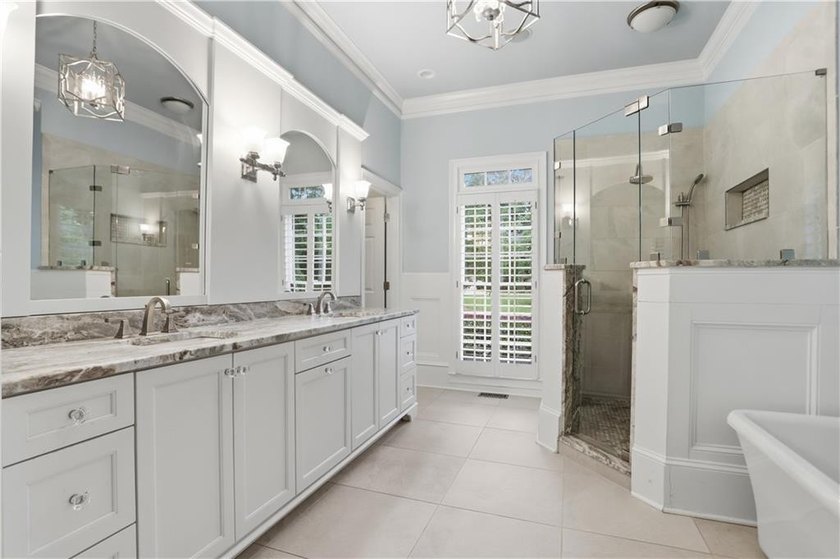 Nestled behind a sweeping lawn on a private, tree-lined lot - photo 34