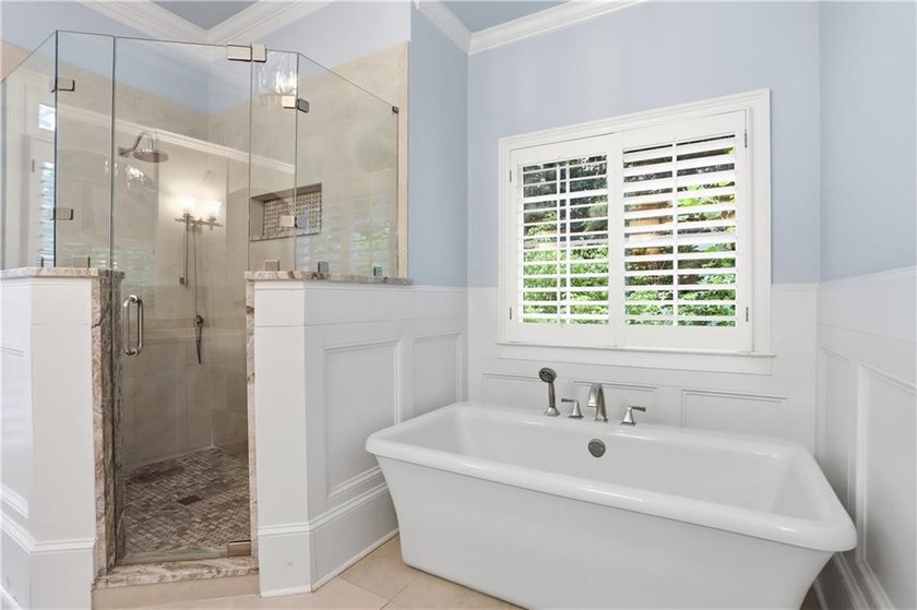 Nestled behind a sweeping lawn on a private, tree-lined lot - photo 35