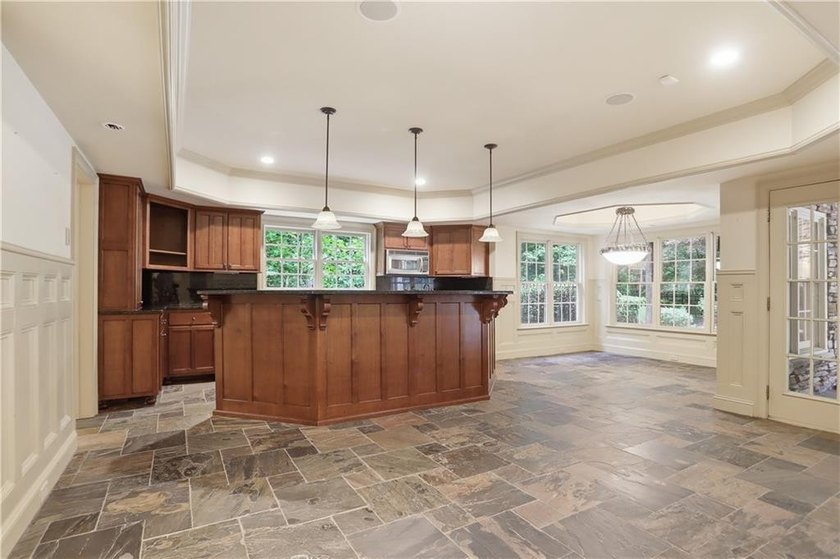 Nestled behind a sweeping lawn on a private, tree-lined lot - photo 45