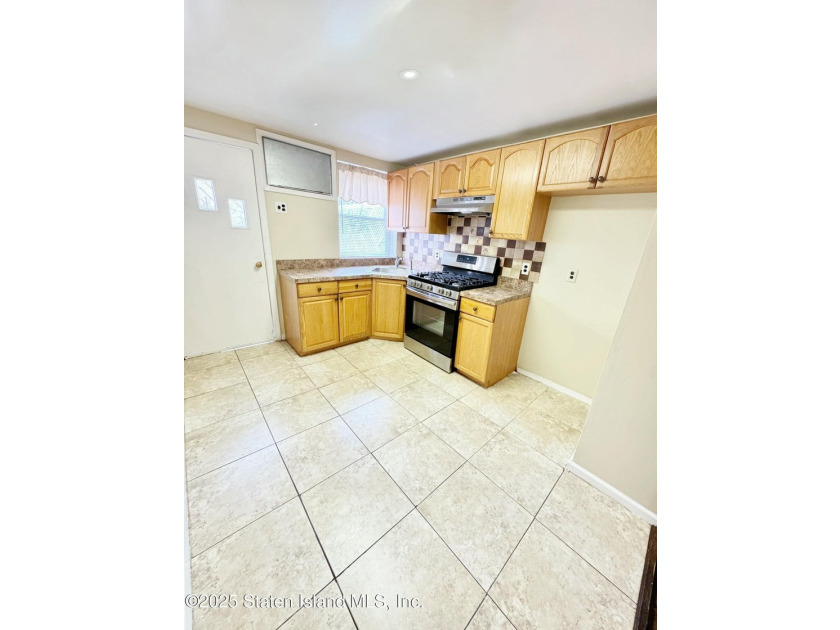 Discover this Large Fabulous Impeccable, 3 Family Home. This - photo 8