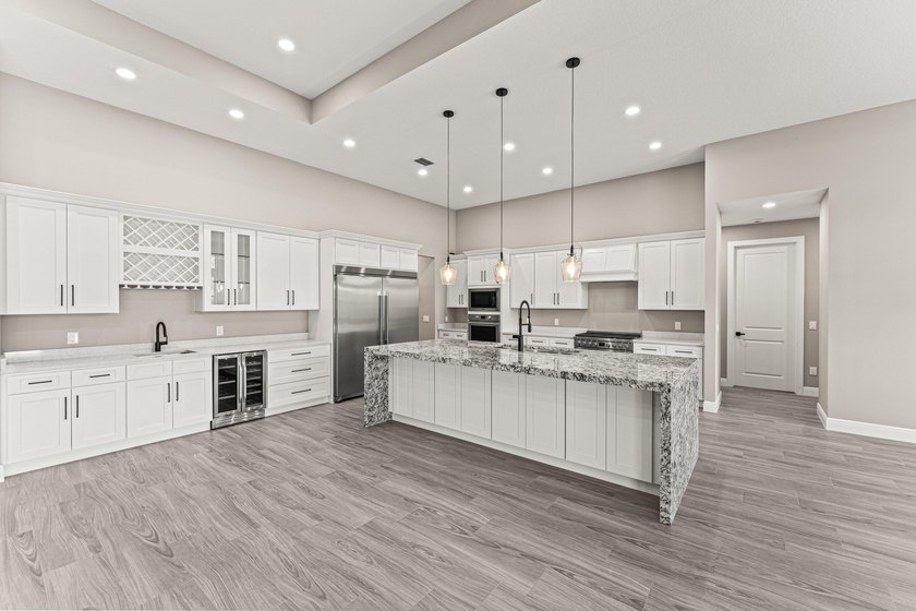 Welcome to 16631 132nd Terrace North, a newly completed custom - photo 11