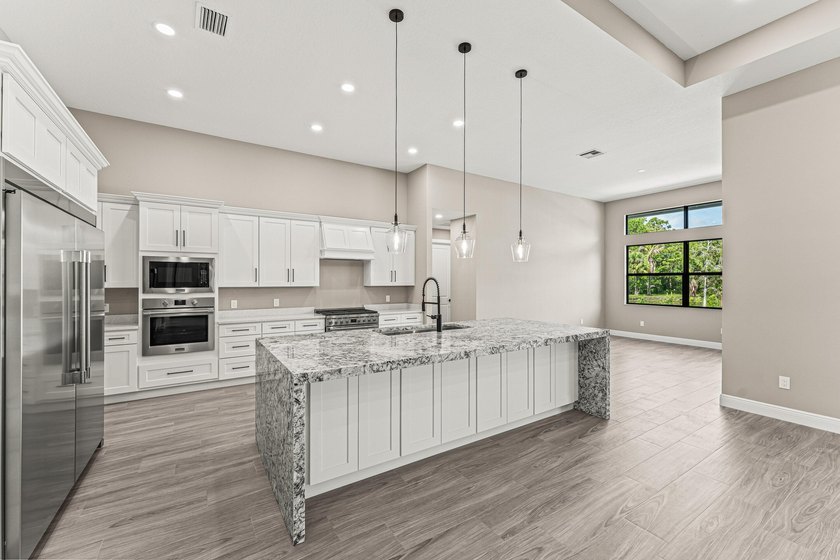 Welcome to 16631 132nd Terrace North, a newly completed custom - photo 12