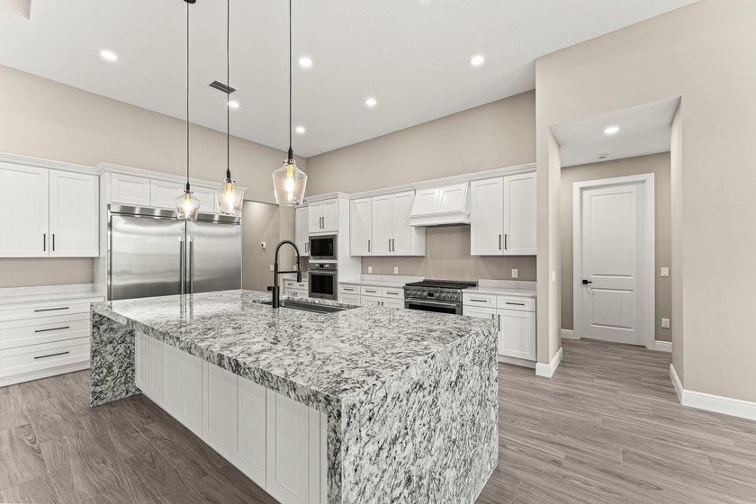 Welcome to 16631 132nd Terrace North, a newly completed custom - photo 17
