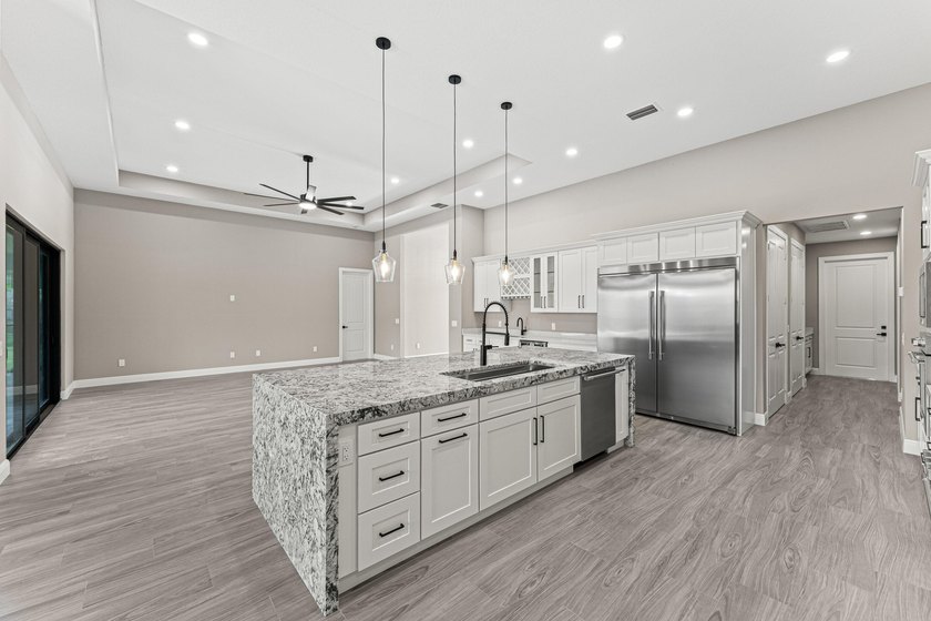 Welcome to 16631 132nd Terrace North, a newly completed custom - photo 19