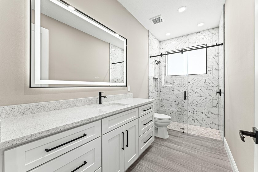 Welcome to 16631 132nd Terrace North, a newly completed custom - photo 31