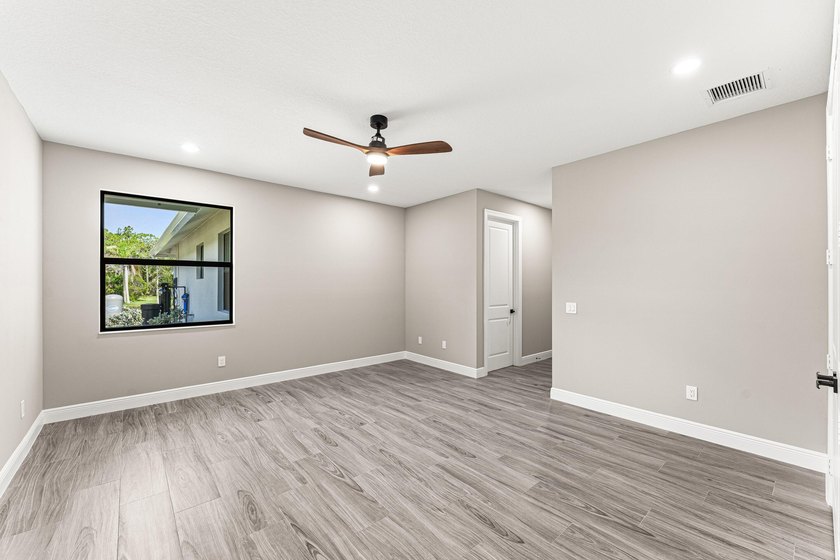 Welcome to 16631 132nd Terrace North, a newly completed custom - photo 35