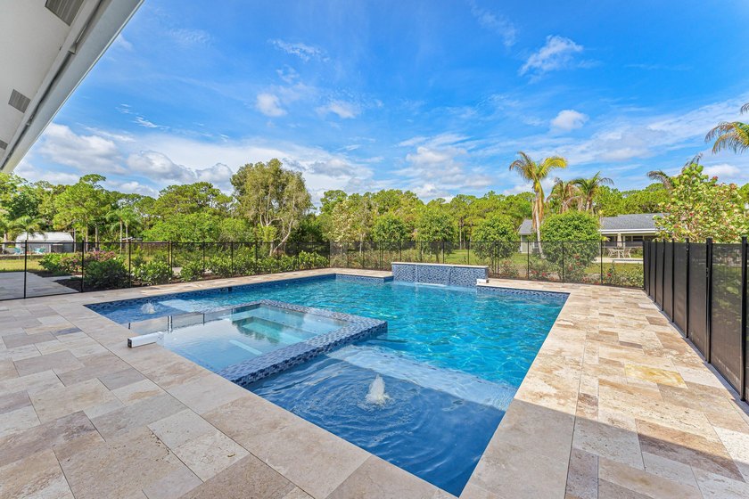 Welcome to 16631 132nd Terrace North, a newly completed custom - photo 45