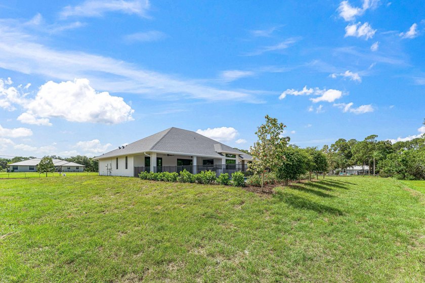 Welcome to 16631 132nd Terrace North, a newly completed custom - photo 49
