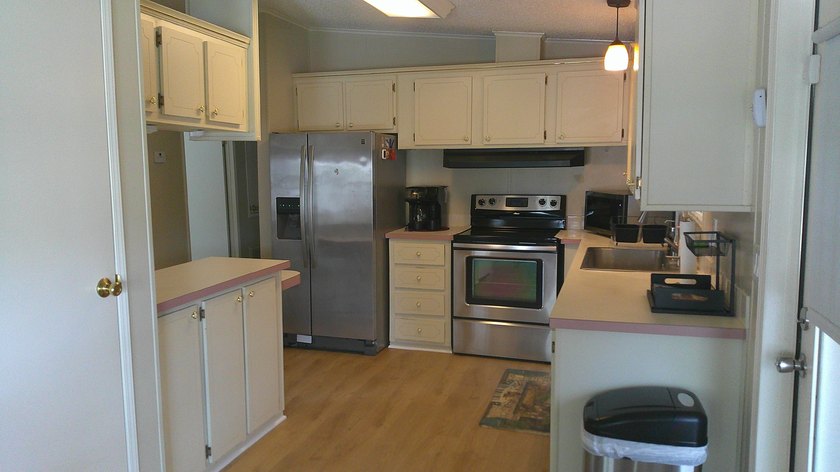 33206 Dockside Lane is located in a 55+ resort style land leased - photo 3