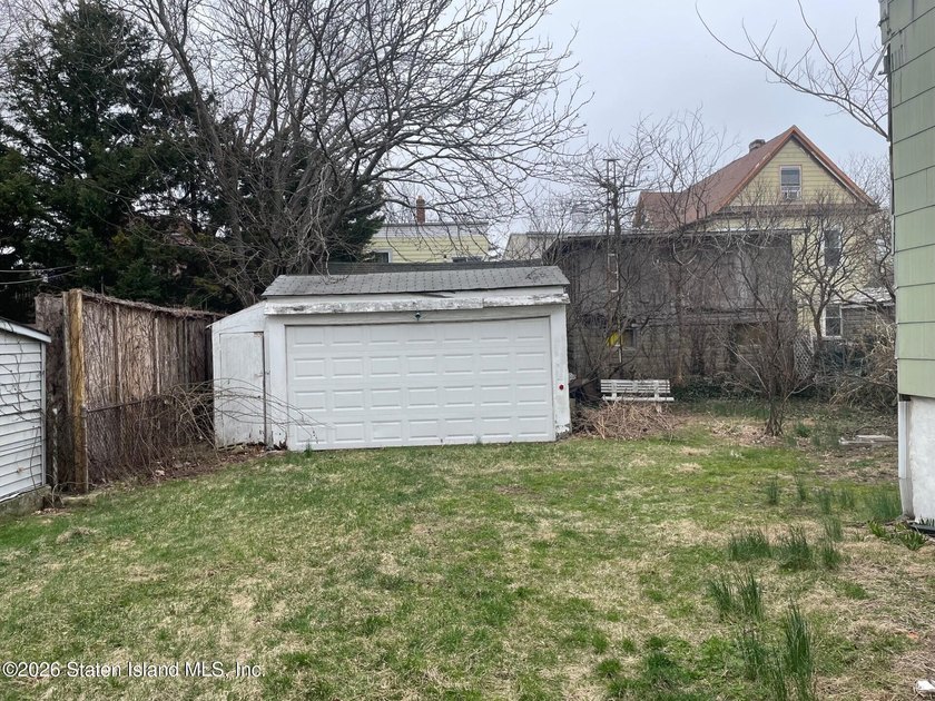 Two family residence in need of updating, offering a strong - photo 8