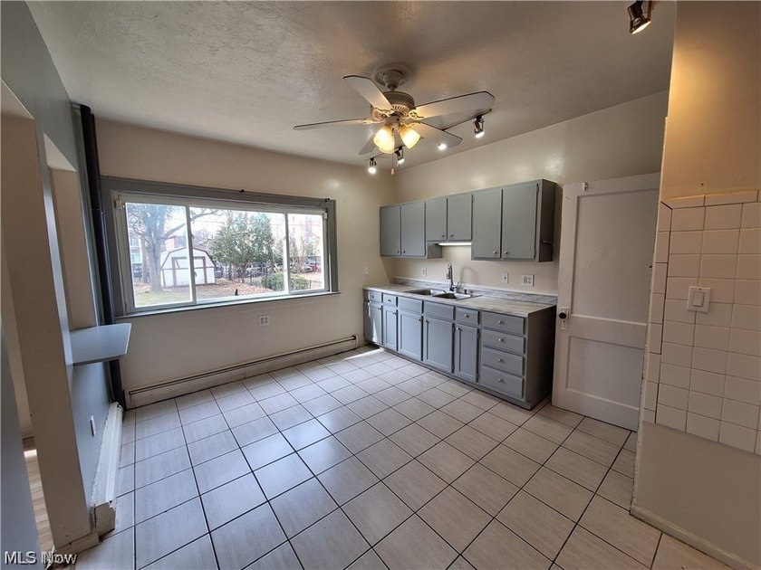 This updated single family colonial home features 3 bedrooms,1 - photo 3