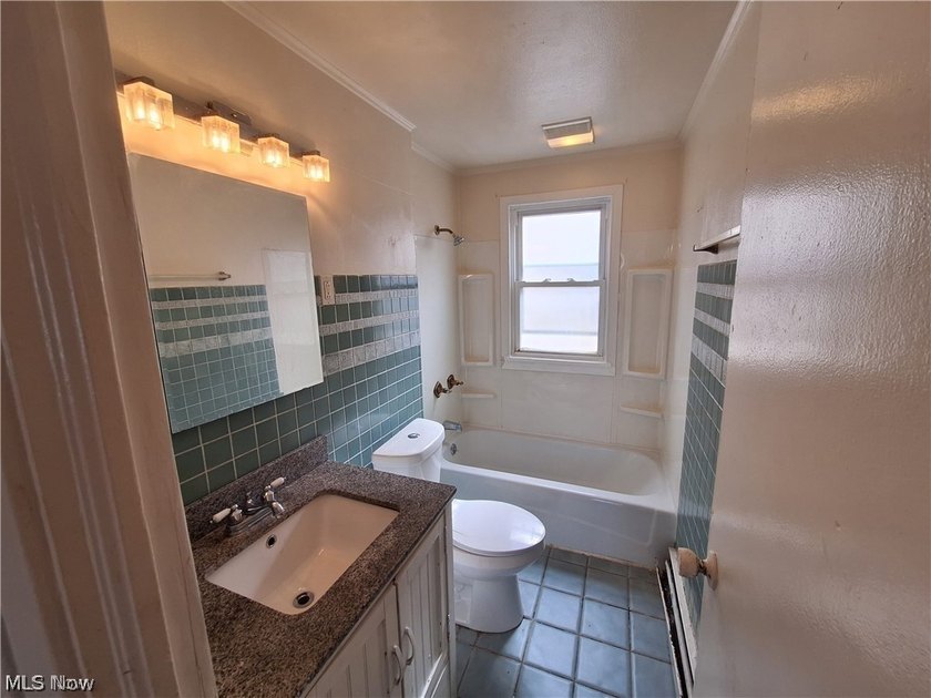 This updated single family colonial home features 3 bedrooms,1 - photo 4