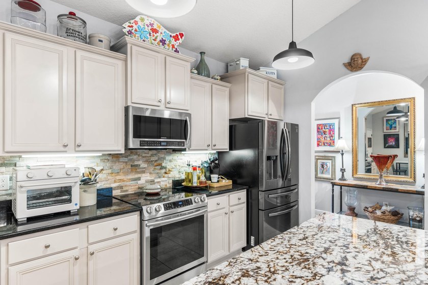 OWNED BY A CONTRACTOR WHO ADDED MANY UPGRADES. SINGLE LEVEL - photo 7