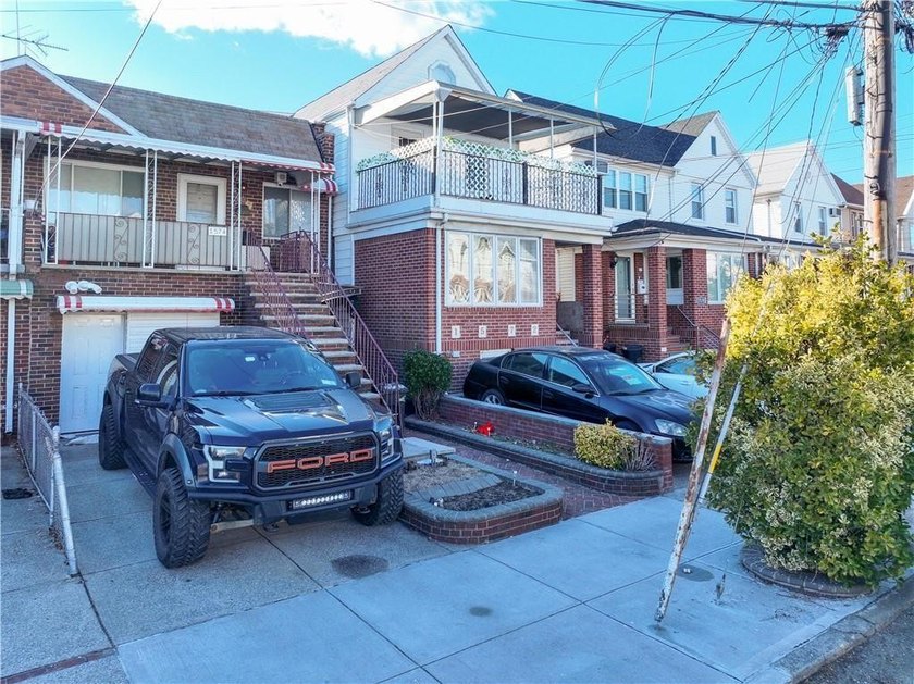 Beautifully renovated 2-family brick home located in the heart - photo 3